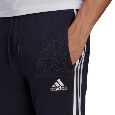5. Spodnie adidas Essentials Fleece Tapered Cuff 3-Band M GK8823