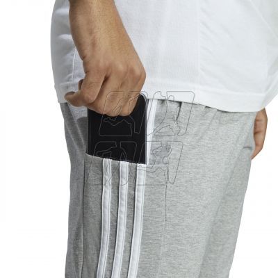 5. Spodnie adidas Essentials Single Jersey Tapered Open Hem 3-Stripes M IC0046