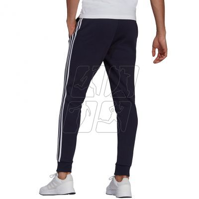 4. Spodnie adidas Essentials Fleece Tapered Cuff 3-Band M GK8823