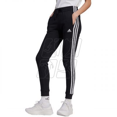 4. Spodnie adidas Essentials 3-Stripes Fleece W HZ5753