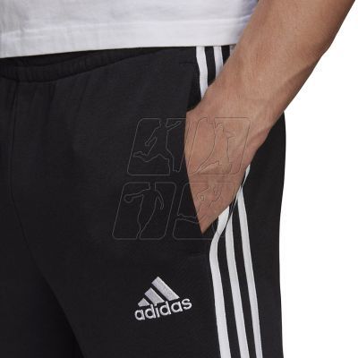 4. Spodnie adidas Essentials Tapered Cuff 3 Stripes M GK8831